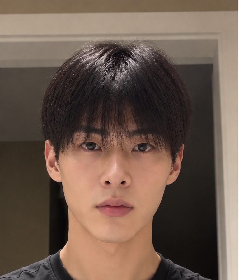 Man with thick straight hair lying flat against his head before styling
